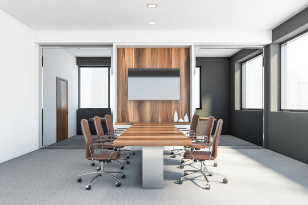 istock White and grey meeting room interior with TV 1221173381