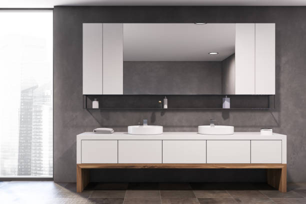 istock Gray and wooden bathroom with double sink 1221173619