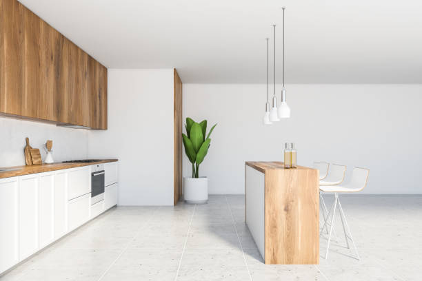 istock Bar counter in white and wooden kitchen interior 1221173634