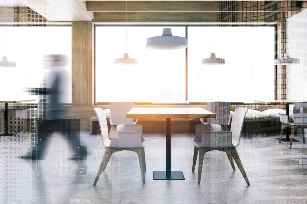 istock Man walking in white and wooden restaurant 1221173665