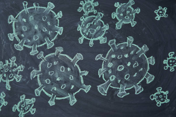 istock Outbreak Warning. written white chalk on blackboard in connection with epidemic of coronavirus worldwide. 1221173835