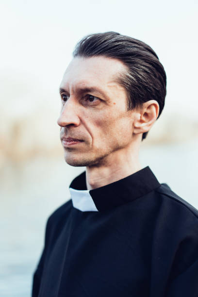 istock Portrait of handsome catholic priest or pastor with collar 1221174129