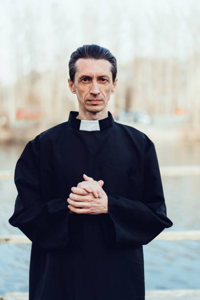istock Portrait of handsome catholic priest or pastor with collar 1221174131