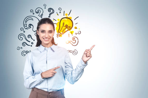 istock Cheerful woman and her bright idea 1221174134