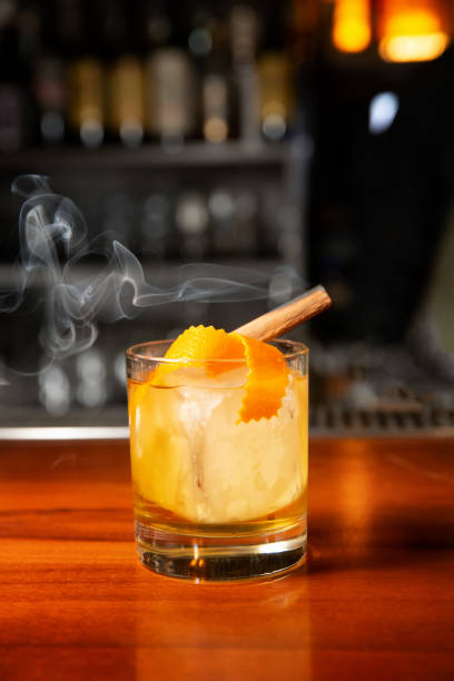 istock Orange cocktail with ice cube and orange zest 1221174266
