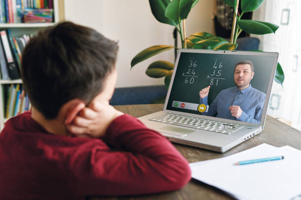istock 6-7 years cute child learning mathematics from computer. Homeschooling concept. 1221175193