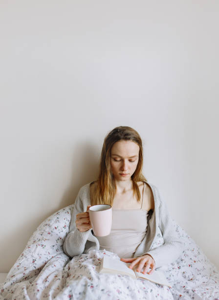 istock Woman enjoying with coffee in bed 1221175227