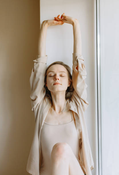istock Cheerful woman stretching in bed at home 1221175450