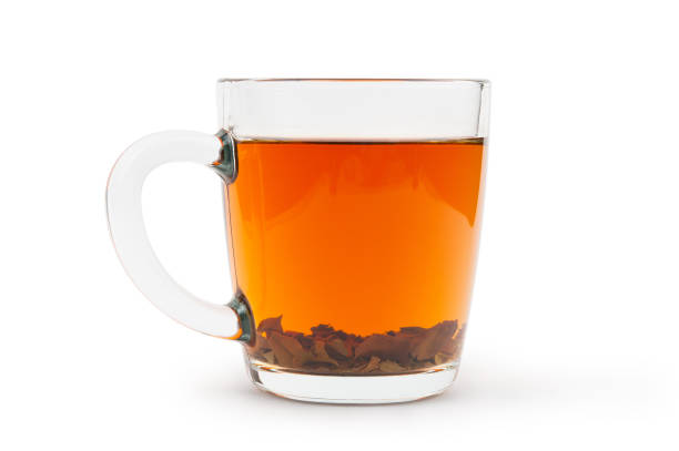 istock Tea with leaves in glass cup isolated on white background 1221175671