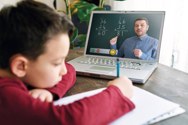 istock 6-7 years cute child learning mathematics from computer. Homeschooling concept. 1221175800