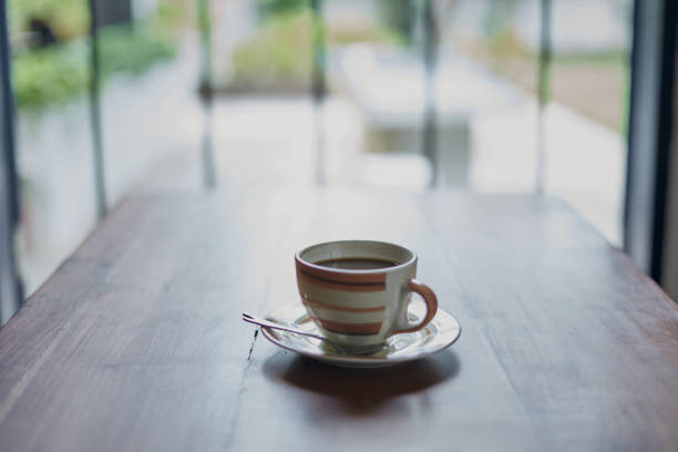 istock Hot Black Coffee on table and nature windows view in winter 1221176660