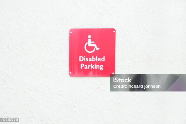 Disability Sign Red Red Disabled Sign On Blank White Wall Stock Photo - Download Image Now ...