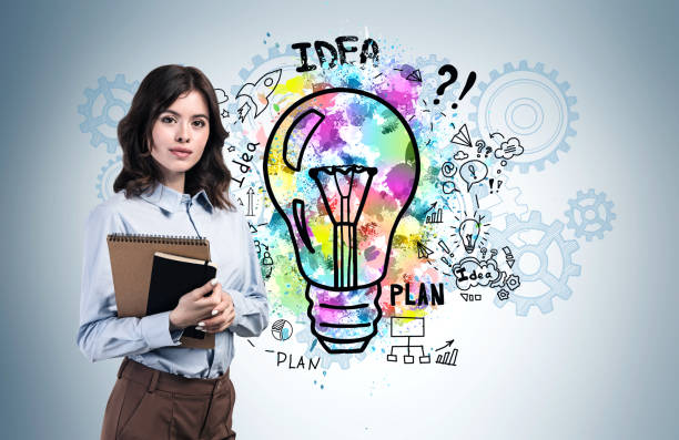 istock Woman with notebook and her business idea 1221179550