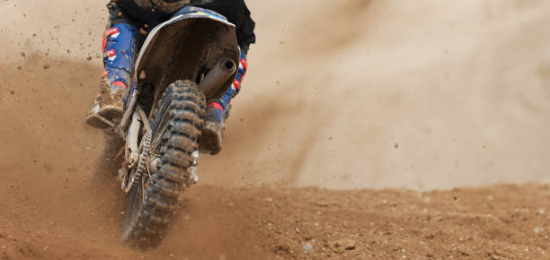 istock Motocross racer accelerating speed in track 1221179663
