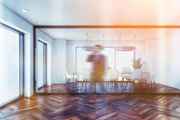 istock Businessman walking in white meeting room 1221179807