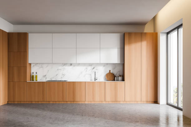 istock White marble kitchen interior, wooden countertops 1221179815