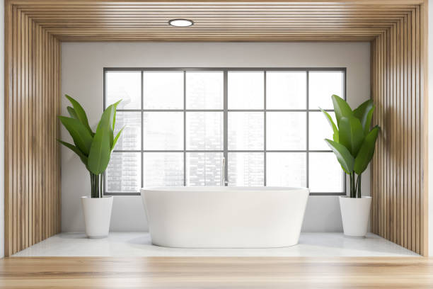 istock Panoramic white and wooden bathroom with tub 1221179882
