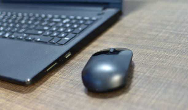 istock mouse,laptop,notebook with copy space on white wooden table, stay home , work at home concept. 1221182447