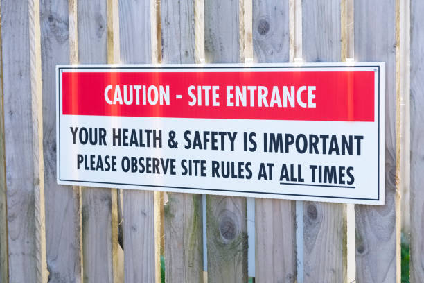 istock Construction building site sign at entrance on gate 1221183994