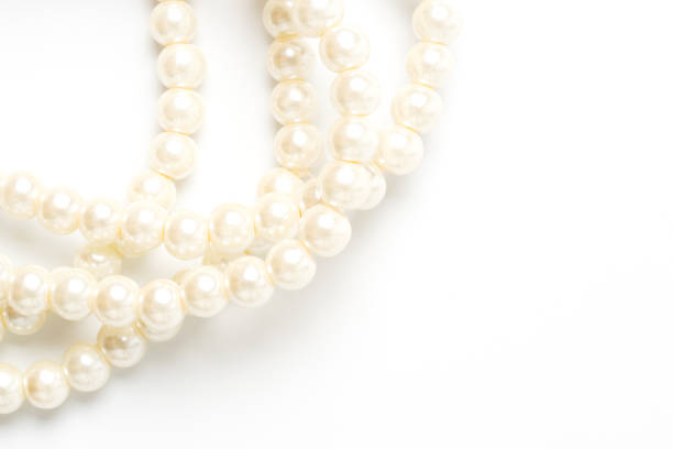 istock pearl necklace isolated on white blackground 1221185842