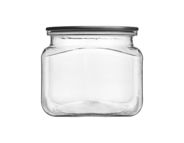 istock Empty transparent glass jar isolated on white 1221186412