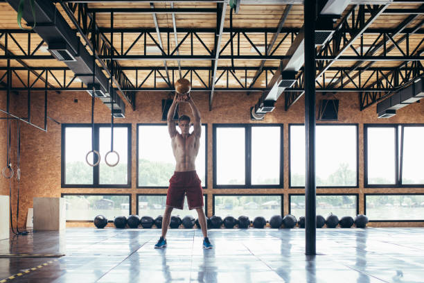 istock Muscular Man Doing Kettlebell Swings 1221186996