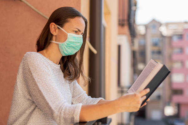 istock Woman in home isolation during covid-19 lockdown 1221189869