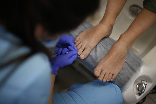 istock Master makes pedicure in beauty salon 1221190451