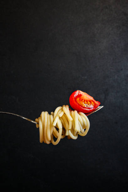 istock pasta spaghetti with tomato and basil, Menu concept healthy eating. food background top view copy space for text 1221190828