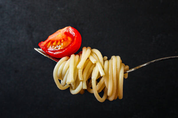 istock pasta spaghetti with tomato and basil, Menu concept healthy eating. food background top view copy space for text 1221190850