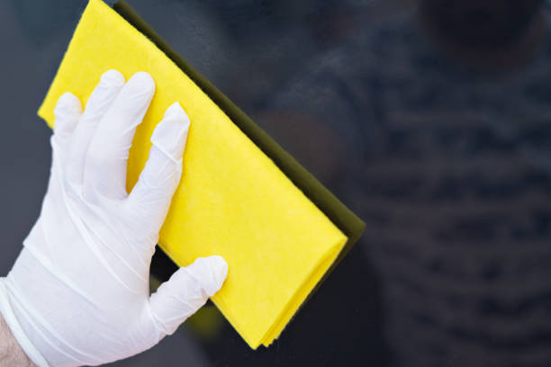 istock Hand in rubber cleaning glove cleaning surface with cleaning equipment 1221191746