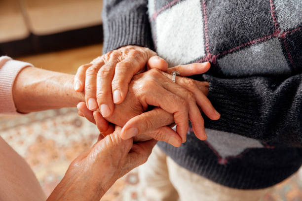 istock Senior Couple Holding Hands 1221191829