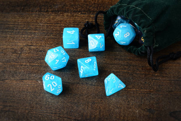 istock closeup blue d & d dice with green velvet bag 1221192010