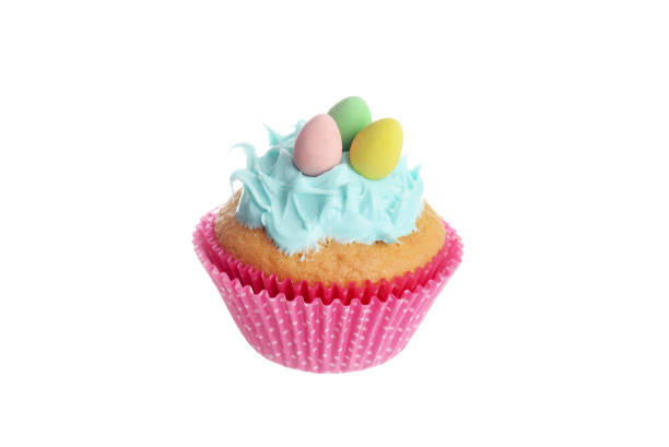istock isolated easter cupcake with blue frosting and chocolate mini eggs 1221192073