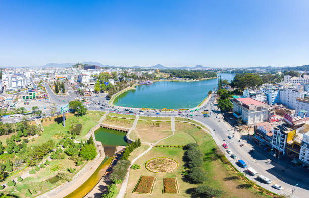 Aerial view of Da Lat city beautiful tourism destination in central highlands Vietnam. Clear blue sky. Urban development texture, green parks and city lake. Aerial view of Da Lat city beautiful tourism destination in central highlands Vietnam. Clear blue sky. Urban development texture, green parks and city lake. dalat photos stock pictures, royalty-free photos & images