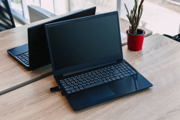 istock modern laptop on the desktop with office supplies. new workplace concept 1221195896