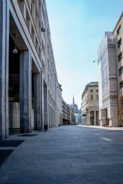 Photo of Empty streets due to covid-19 virus. Lockdown in european town. Strange spring in Milan corso Vittorio Emanuele Italy. Report from the deserted cities, people are locked up. Nobody can go out