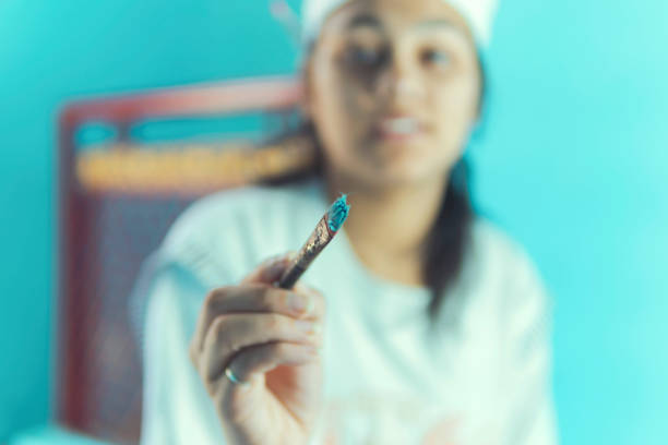 Indian young girl doing paint on wall.indoor shoot at home. copy space.