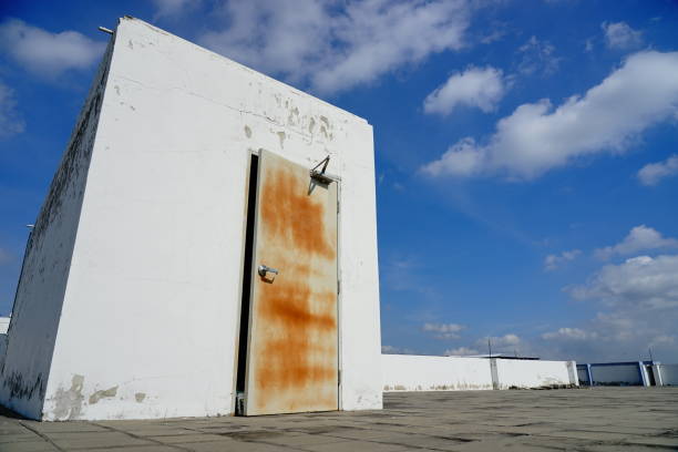 istock Front View of Locked Iron Door on Rooftop 1221197923