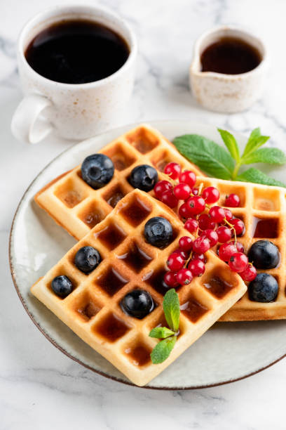 istock Belgian waffles with fresh summer berries 1221198268