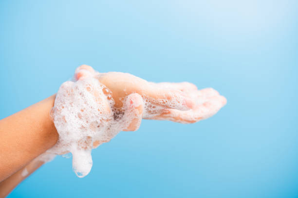 istock woman washing hands with soap have foam 1221199285