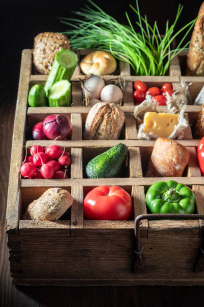 istock Ingredients for sandwich with fresh vegetables in wooden box 1221199432