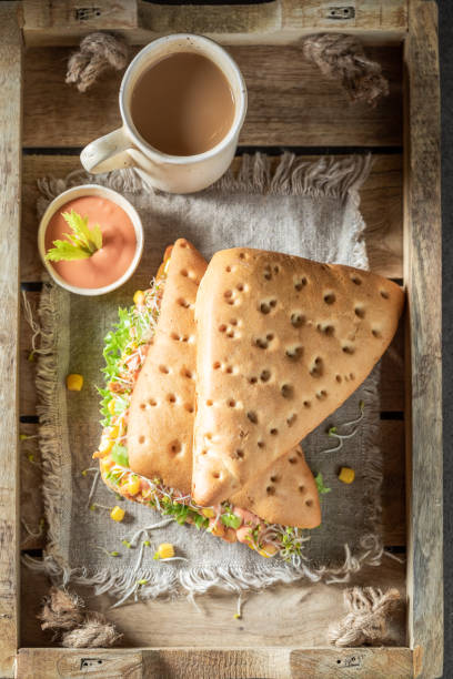 istock Homemade sandwich with green lettuce, corn, and ham 1221199632