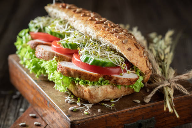 istock Fresh sandwich with grilled chicken, lettuce and tomatoes 1221199766