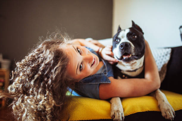 istock Woman playing with her dogs 1221199790