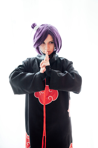 woman anime cosplayer with purple hair