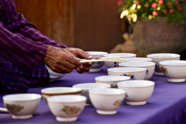 The Indian 'Jal Tarang' is a melodic percussion instrument. It consists of a set of ceramic or metal bowls filled with water, which are played by striking the edge with beaters, one in each hand.