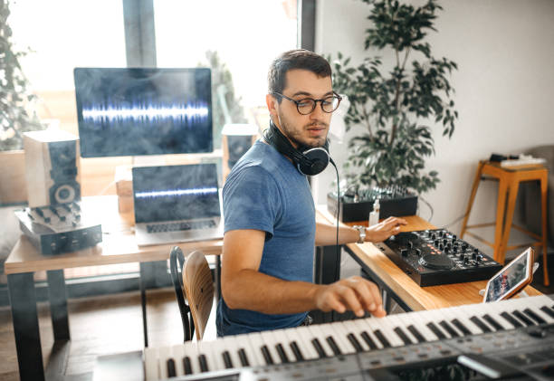 istock Music composer using electronic equipment to make music 1221201353