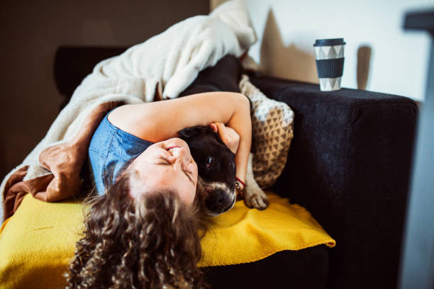 istock Woman playing with her dogs 1221202933