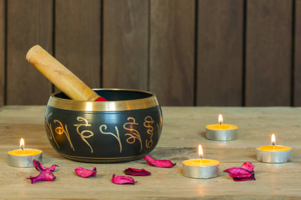 istock Studio shot of Tibetan singing bowls with burning candles 1221203258